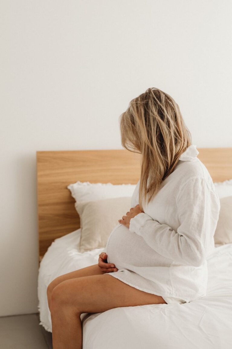 pregnant woman on bed