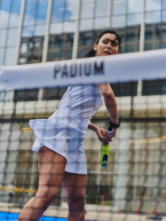 a woman playing a padel game - 
