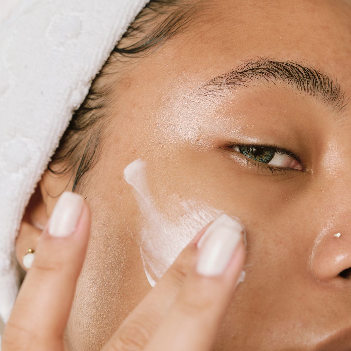 woman applying face cream