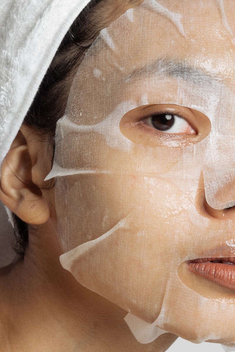 woman in a sheet mask