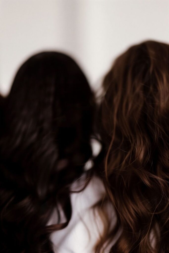 mum and daughter from behind hair only