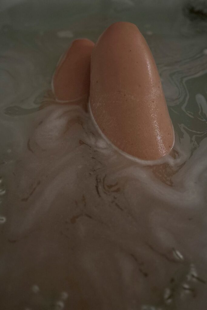 womans legs in a bath
