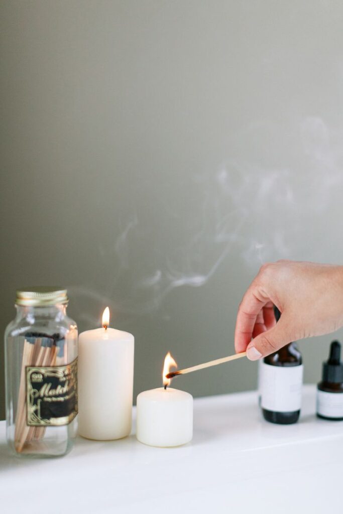 hand lighting candles