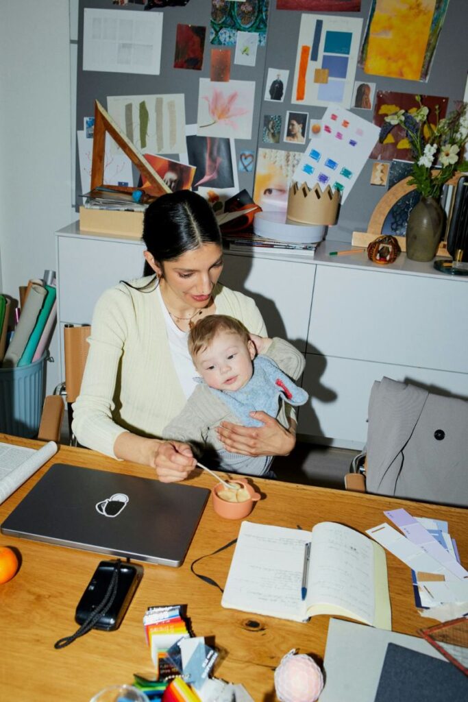 working mom while trying to feed baby